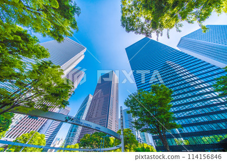 Shinjuku, Tokyo cityscape in Japan. View of Nishi-Shinjuku sign at the intersection behind Shinjuku Police Station and skyscrapers, April 28th Shinjuku, Tokyo cityscape in Japan. View of Nishi-Shinjuku sign at the intersection behind Shinjuku Police Station and skyscrapers, April 28th 114156846
