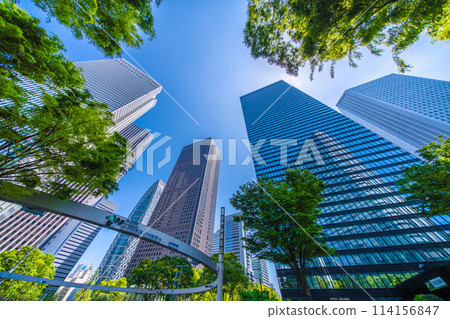 Shinjuku, Tokyo cityscape in Japan. View of Nishi-Shinjuku sign at the intersection behind Shinjuku Police Station and skyscrapers, April 28th Shinjuku, Tokyo cityscape in Japan. View of Nishi-Shinjuku sign at the intersection behind Shinjuku Police Station and skyscrapers, April 28th 114156847