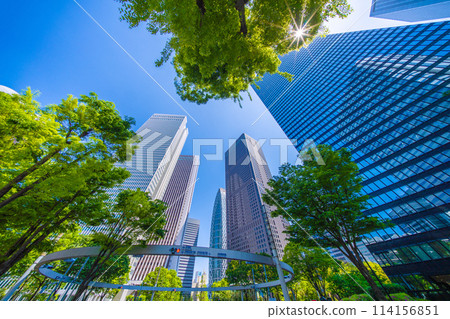 Shinjuku, Tokyo cityscape in Japan. View of Nishi-Shinjuku sign at the intersection behind Shinjuku Police Station and skyscrapers, April 28th Shinjuku, Tokyo cityscape in Japan. View of Nishi-Shinjuku sign at the intersection behind Shinjuku Police Station and skyscrapers, April 28th 114156851