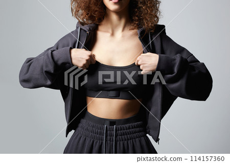 pretty curly hairstyle girl in knitted suit with hood and underwear pretty curly hairstyle girl in knitted suit with hood and underwear 114157360
