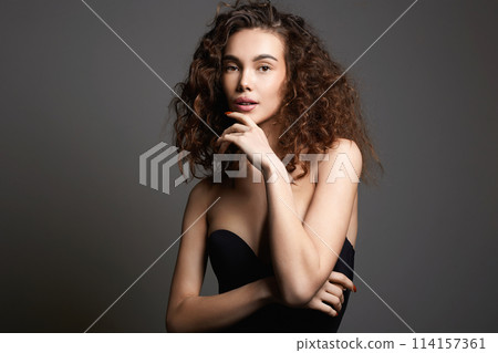 beautiful young woman with curly hair. pretty sexy girl beautiful young woman with curly hair. pretty sexy girl 114157361