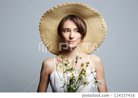 village girl in hat with flowers. beautiful young woman with chamomile village girl in hat with flowers. beautiful young woman with chamomile 114157438