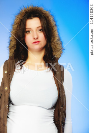 Woman in casual waistcoat. Winter fashion. Woman in casual waistcoat. Winter fashion. 114158368