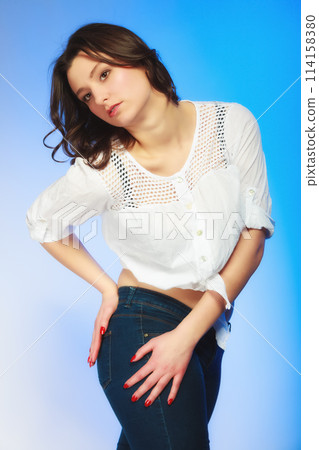 plus size woman in casual clothes posing in studio 114158380