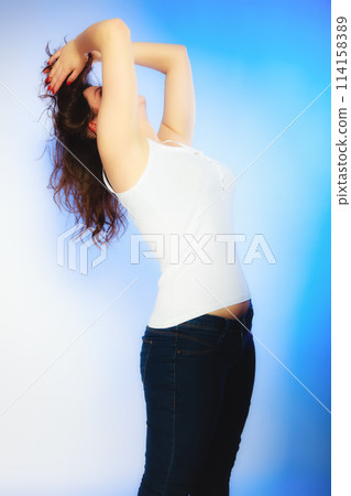plus size woman in casual clothes posing in studio 114158389