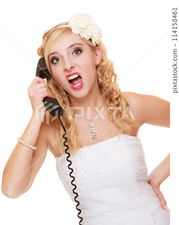 Wedding. Angry woman fury bride talking on phone Wedding. Angry woman fury bride talking on phone 114158461