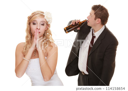 Wedding couple, bride with alcoholic drinking groom. Wedding couple, bride with alcoholic drinking groom. 114158654