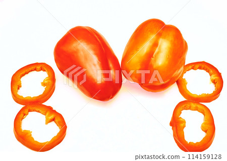 Red sweet ripe pepper cut into circles,slices on white Red sweet ripe pepper cut into circles,slices on white 114159128