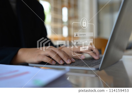 Businesswoman typing the password on laptop to access account on website. Cybersecurity concept 114159453