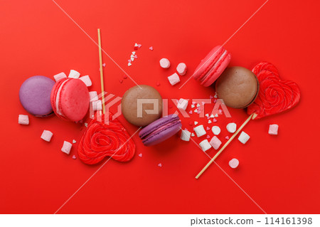 Various colorful candies, lollipops, and macaroons 114161398