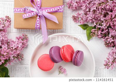 Colorful macaroons, arranged in a delightful display of vibrant hues Colorful macaroons, arranged in a delightful display of vibrant hues 114161451