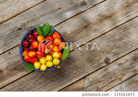 A vibrant and colorful cherry, bursting with sweet juiciness 114161655