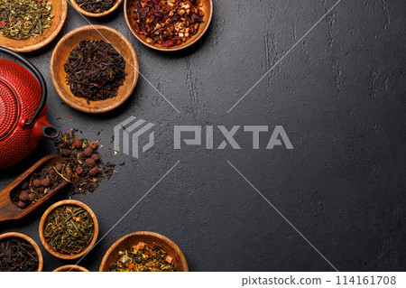 A collection of various teas nestled in wooden bowls A collection of various teas nestled in wooden bowls 114161708