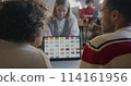 Group of people designers talking and using laptop discussing colors in creative cafe. Start-up and successful entrepreneur concept. 114161956