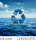 A blue ocean with a recycling symbol in the middle. The ocean is full of water and the recycling symbol is floating on top of it 114161959