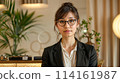A woman staff looking like a fashion model at the front desk of a luxury hotel 114161987