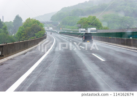 Image of driving on a highway in the rain 114162674