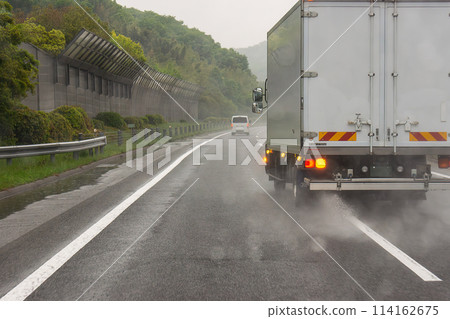 Image of driving on a highway in heavy rain Image of driving on a highway in heavy rain 114162675