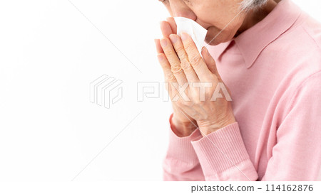 Senior woman blowing her nose Allergy Senior woman blowing her nose Allergy 114162876