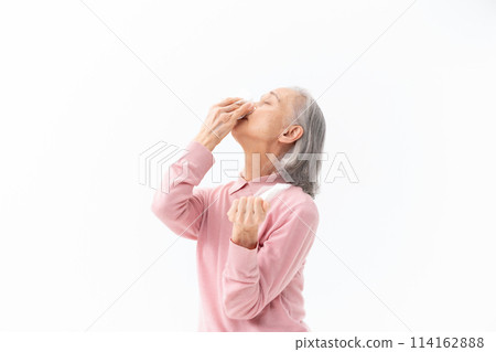 Senior woman blowing her nose Allergy Senior woman blowing her nose Allergy 114162888