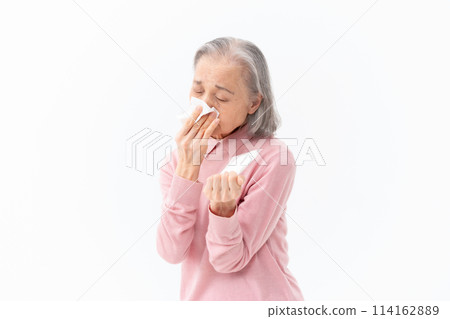 Senior woman blowing her nose Allergy Senior woman blowing her nose Allergy 114162889