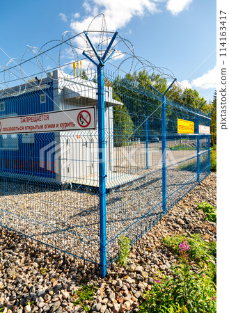 Gas regulatory and distribution point outside the city. Text on russian 114163417