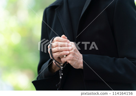 Senior woman in mourning clothes, hands Senior woman in mourning clothes, hands 114164156