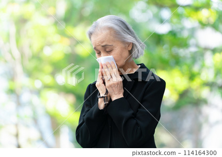 Woman in mourning clothes crying handkerchief Woman in mourning clothes crying handkerchief 114164300