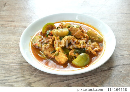 spicy boiled slice pork with eggplant in curry soup on plate spicy boiled slice pork with eggplant in curry soup on plate 114164538