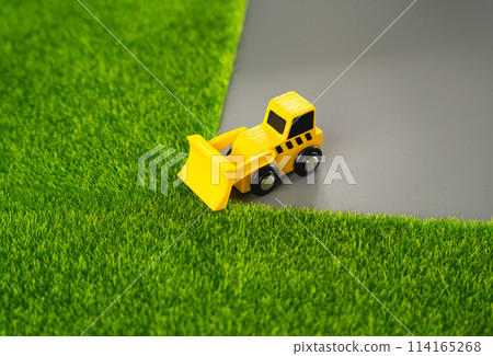 A bulldozer destroys nature, clearing the area for new construction. Harms to environment and natural diversity. Protection of natural resources. Reduction of agricultural land. A bulldozer destroys nature, clearing the area for new construction. Harms to environment and natural diversity. Protection of natural resources. Reduction of agricultural land. 114165268