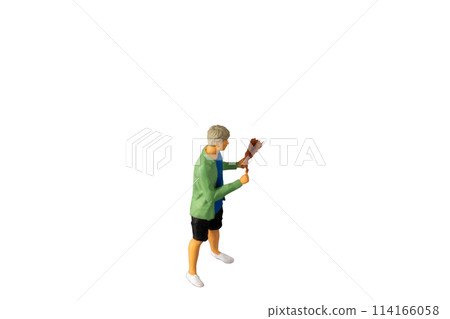 Miniature people , A young man with a BBQ Isolated on white background with clipping path 114166058