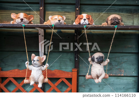 Adorable dog figure or doll at local shop in Yufuin, Oita, Japan. 114166110