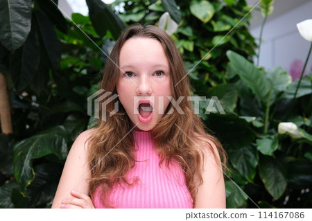 Beautiful cute girl opened her mouth in surprise. High quality photo 114167086