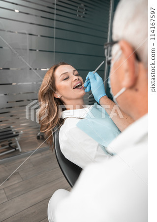 Modern dentistry allows patients to feel comfortable and safe during treatment. The patient's smile becomes happy and healthy thanks to the dental clinic. 114167597