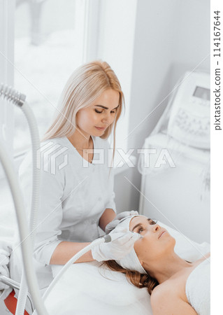 A cosmetologist, a true professional, uses vacuum and RF lifting to provide the client with effective and safe procedures that solve the problems of skin aging. A cosmetologist, a true professional, uses vacuum and RF lifting to provide the client with effective and safe procedures that solve the problems of skin aging. 114167644
