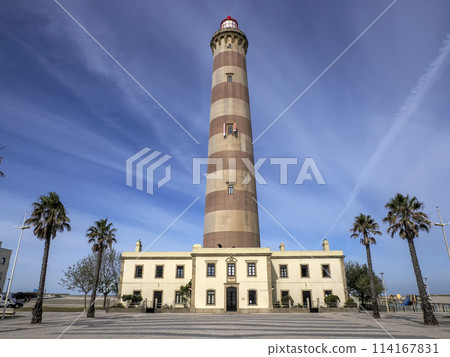 Farol de Aveiro. Lighthouse in the coast of Aveiro, in front of atlantic ocean, biggest of Portugal Farol de Aveiro. Lighthouse in the coast of Aveiro, in front of atlantic ocean, biggest of Portugal 114167831