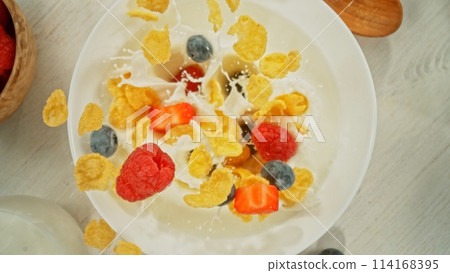 Freeze Motion of Falling Cereals into Bowl with Milk. 114168395