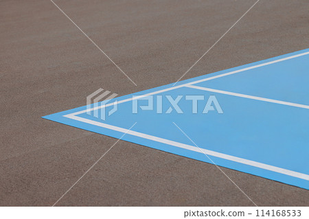 A blue and white tennis court with a white line A blue and white tennis court with a white line 114168533