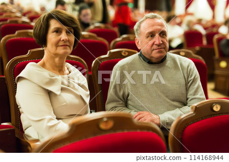Elderly couple watching play in the theater 114168944