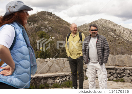 senior friends tourists outdoor adventure together on mediterranian sea landscape 114170326