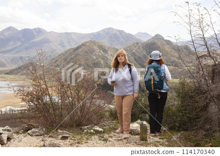 senior friends tourists outdoor adventure together on mediterranian sea landscape senior friends tourists outdoor adventure together on mediterranian sea landscape 114170340
