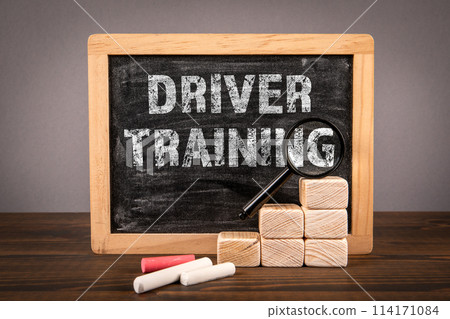 Driver Training. Chalkboard with text on wooden texture table 114171084