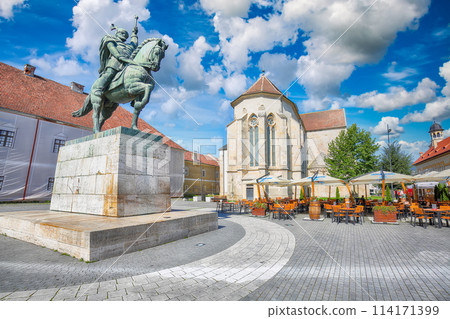 Statue of Michael the Brave and St Michael's Roman Catholic Cathedral in medieval fortress of Alba Iulia (Carolina). Statue of Michael the Brave and St Michael's Roman Catholic Cathedral in medieval fortress of Alba Iulia (Carolina). 114171399