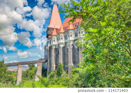 Captivating morning view of Hunyad Castle / Corvin's Castle with wooden bridge. 114171403
