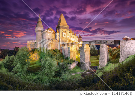 Fabulous night scene of Hunyad Castle / Corvin's Castle with wooden bridge 114171408