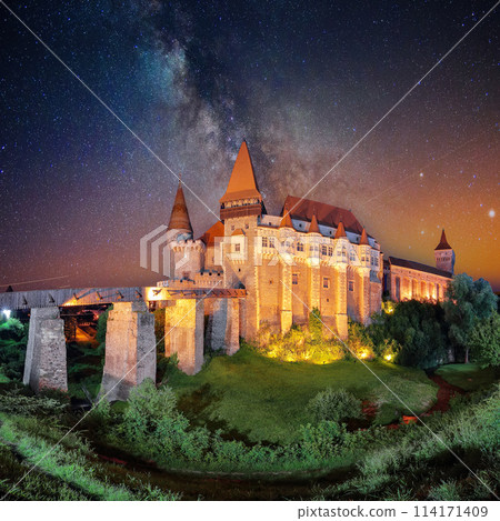 Fabulous night scene of Hunyad Castle / Corvin's Castle with wooden bridge 114171409