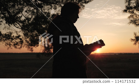 girl woman praying at sunset, hand sunset faith pain, asking heaven for help, bible book, young adult prayer, devout sunset reflection, peaceful prayer session, solitude prayer evening, spiritual 114171532