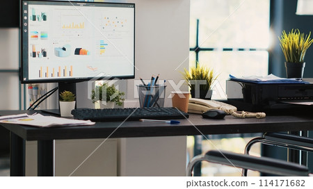 Wheelchair in inclusive office and display showing marketing planning data. Medical chair in workspace offering accessibility to workers with disability and monitor with business analytics Wheelchair in inclusive office and display showing marketing planning data. Medical chair in workspace offering accessibility to workers with disability and monitor with business analytics 114171682