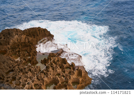 Cinematic aerial landscape shots of the beautiful island of Nusa Penida. Huge cliffs by the shoreline and hidden dream beaches with clear water and foaming wave. Cinematic aerial landscape shots of the beautiful island of Nusa Penida. Huge cliffs by the shoreline and hidden dream beaches with clear water and foaming wave. 114171821