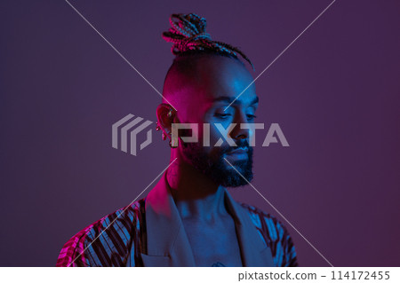 Black man in neon studio light 114172455